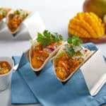 roasted mango salsa on two street tacos